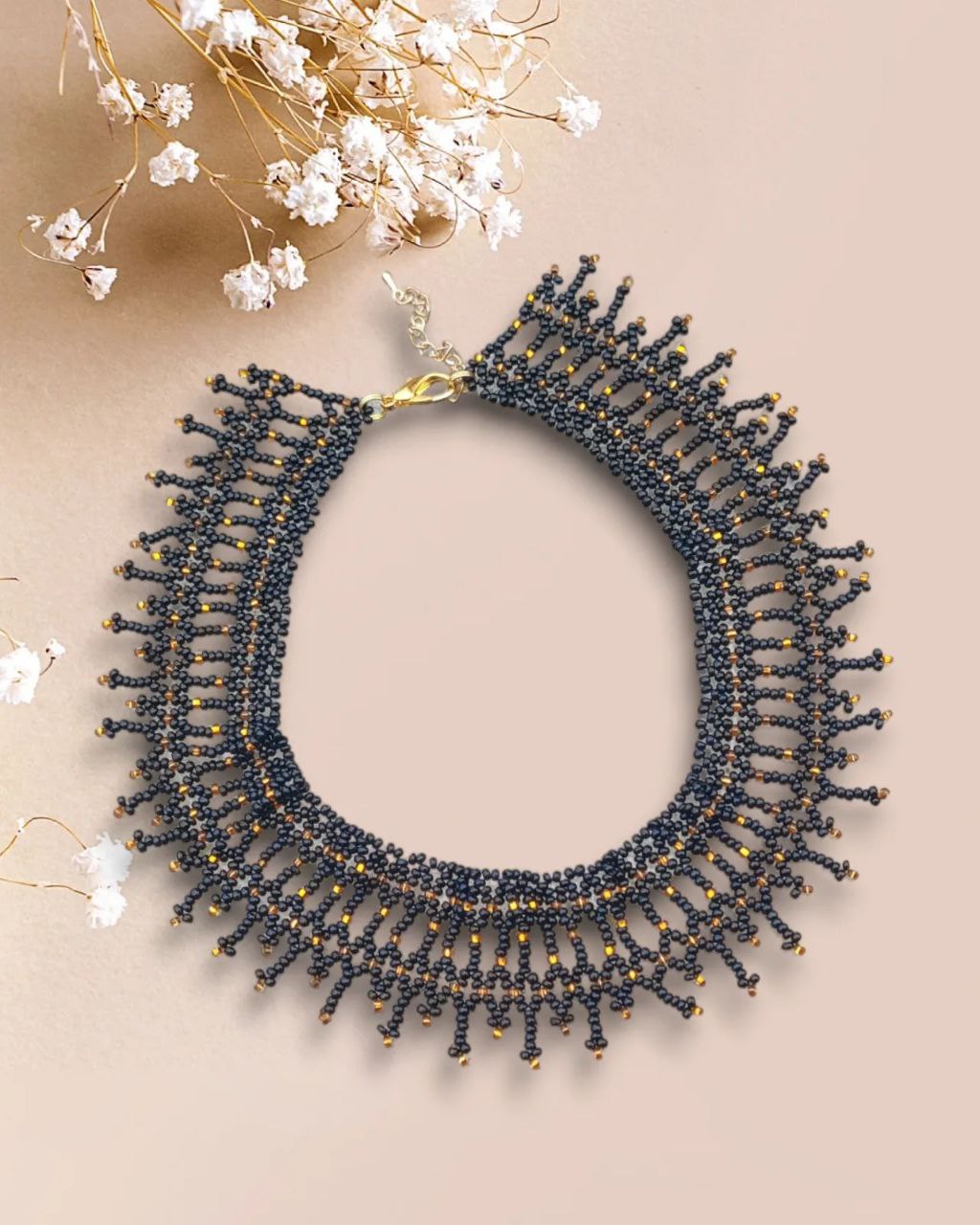 Handmade black beaded choker with golden accents