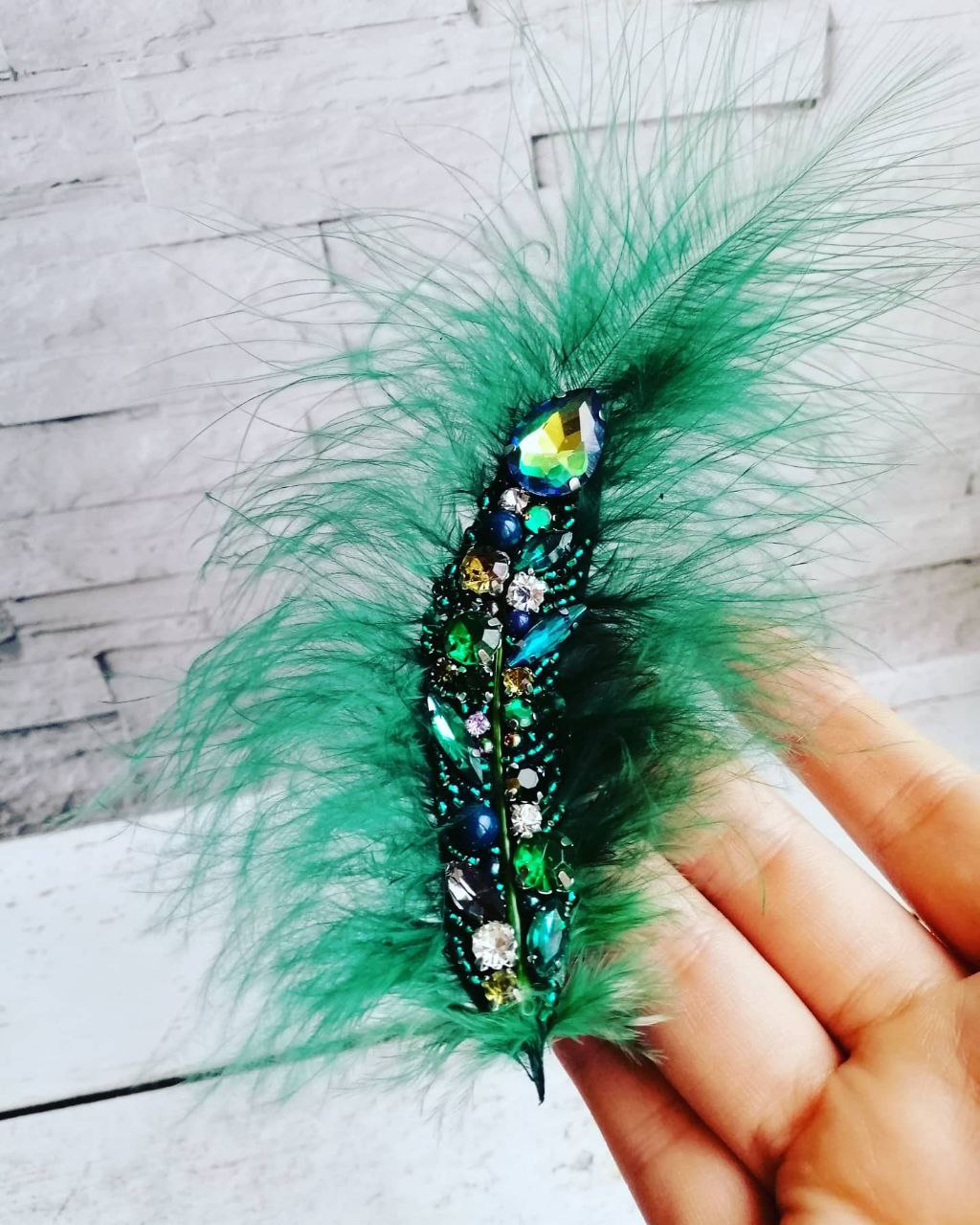 Handmade brooch with emerald feathers and crystals