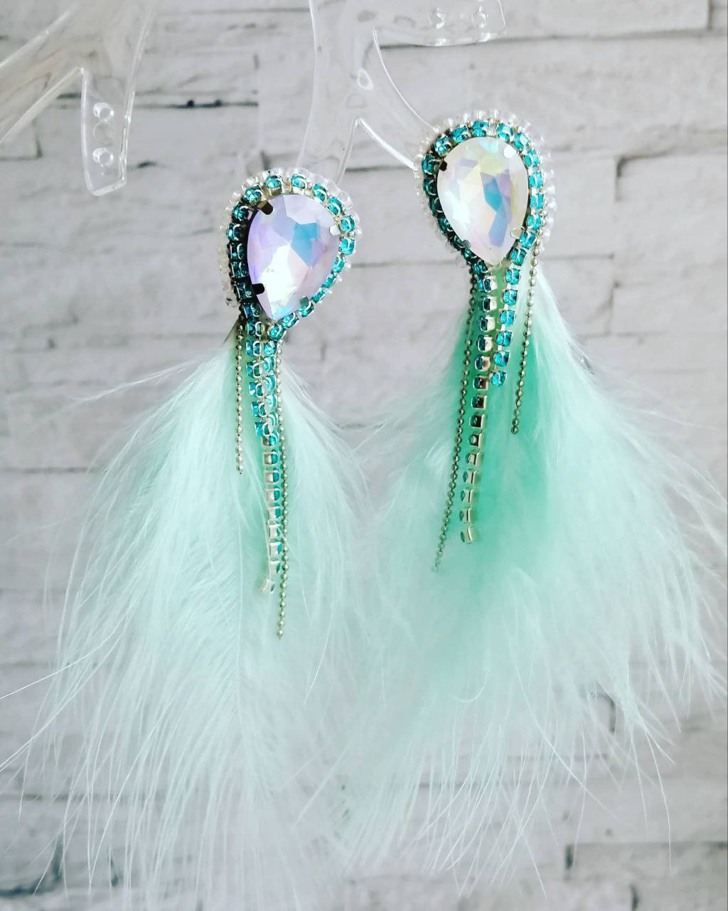 Long earrings with aqua feathers and rhinestones