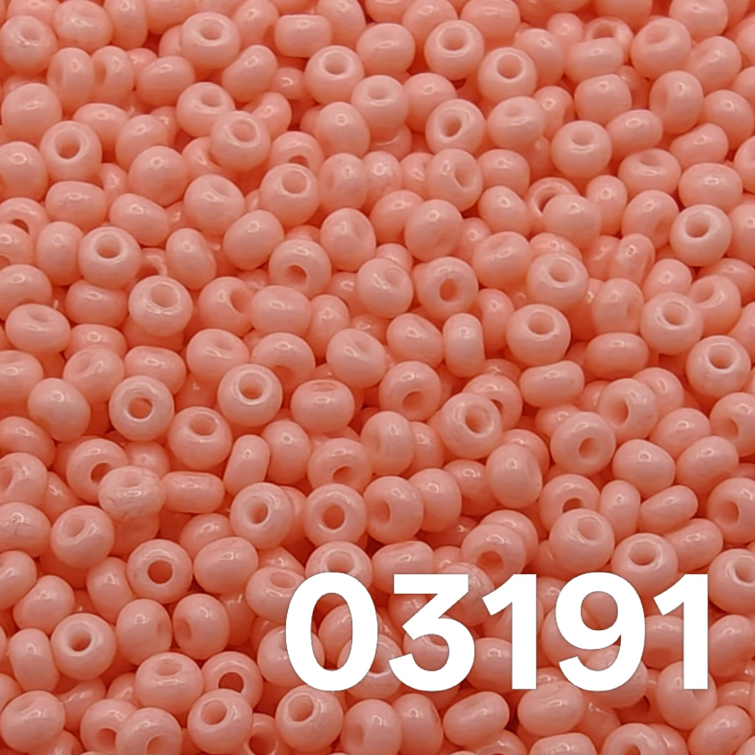 Macro close-up of Preciosa 10/0 Czech glass seed beads - Solgel Chalk Coral Pink 03191