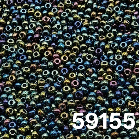 Macro close-up of Preciosa 10/0 Metallic Green Iris (59155) round seed beads — emerald/teal with peacock luster shifts to indigo, purple and bronze, Czech glass.