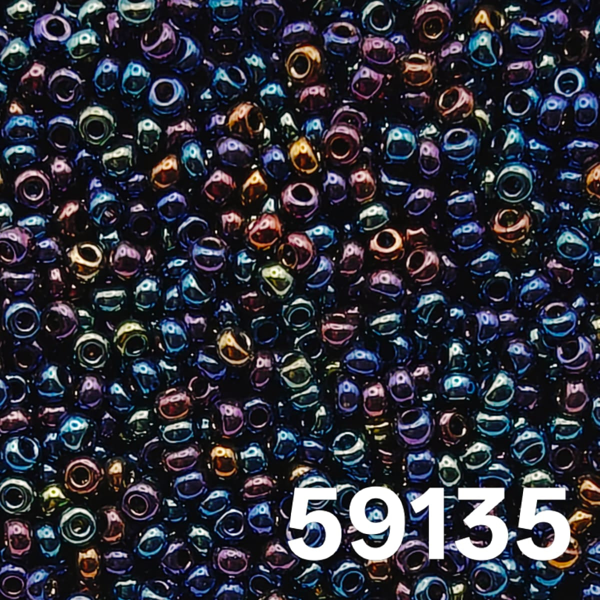 Macro close-up of Preciosa 10/0 round seed beads, Metallic Navy Iris (59135) — iridescent blue-purple peacock luster, Czech glass.