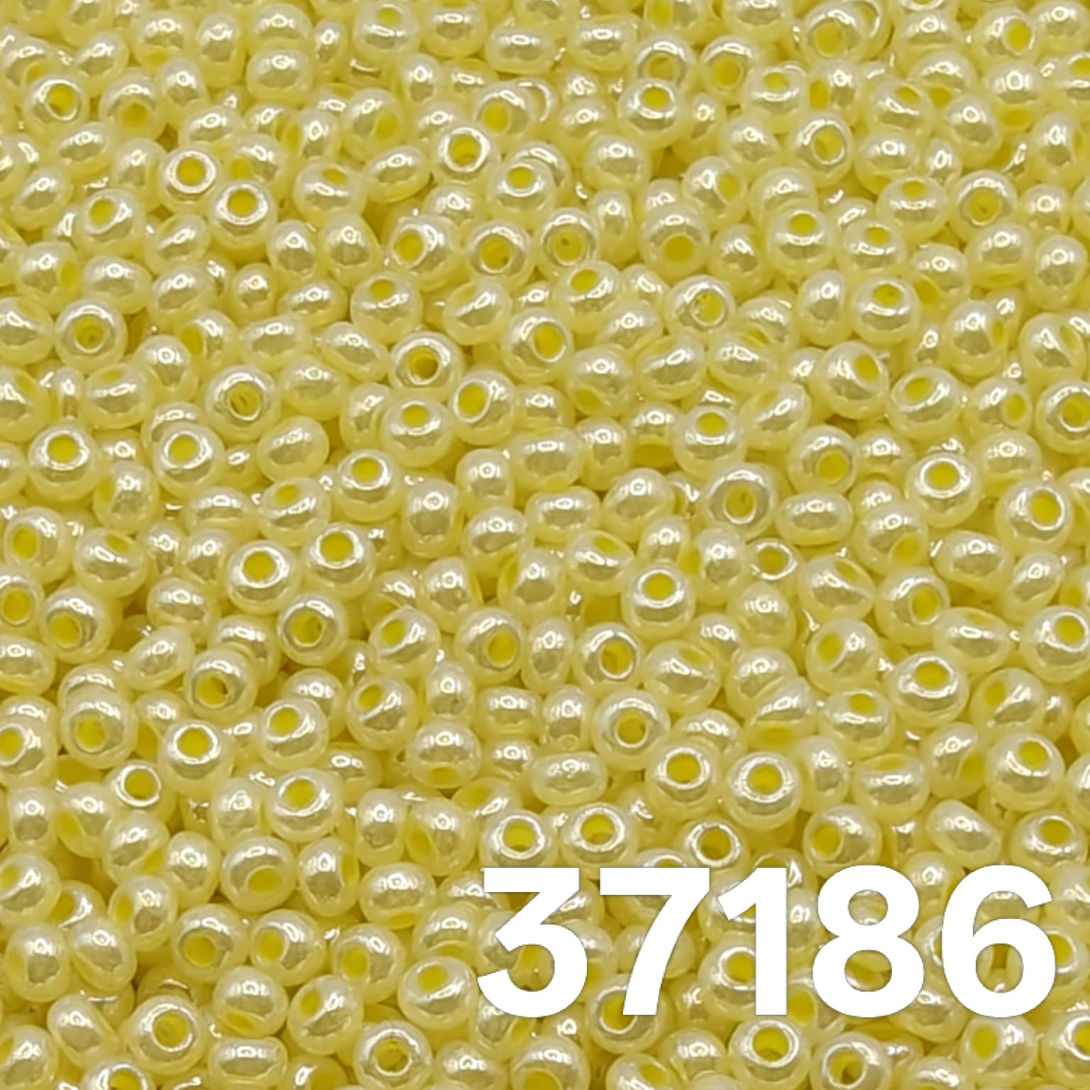 Main macro image: Preciosa Czech seed beads 10/0 pearlized yellow 37186 macro close-up