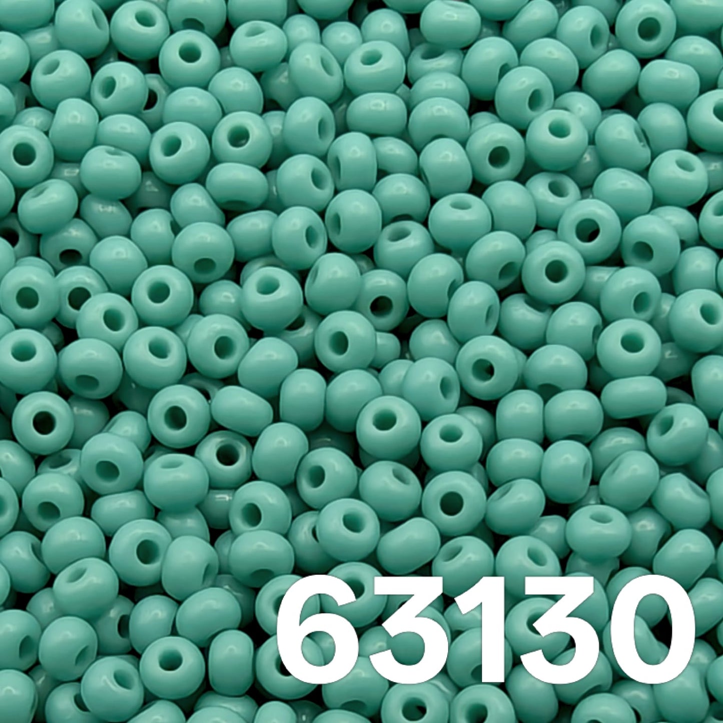 Opaque green turquoise Czech glass seed beads size 10 63130 macro photo