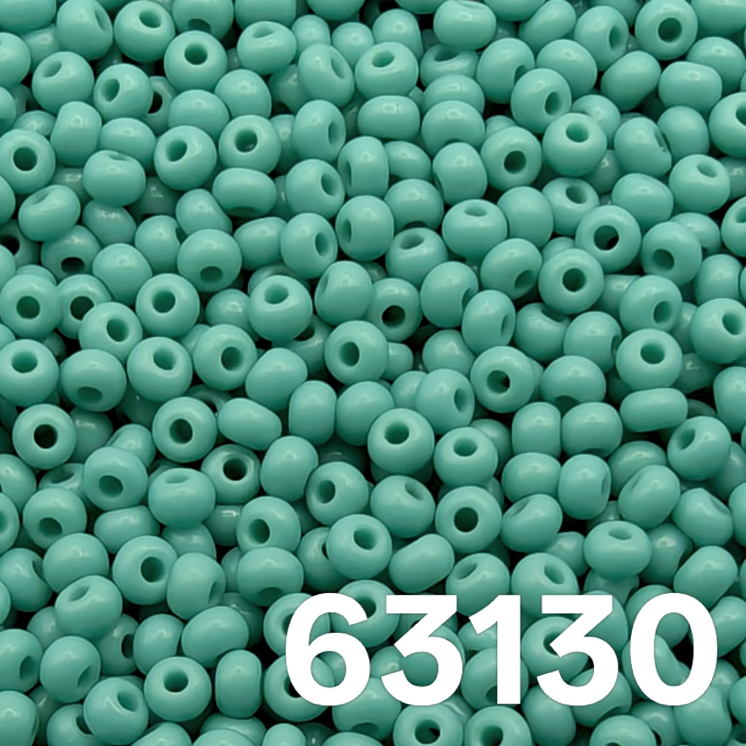 Opaque green turquoise Czech glass seed beads size 10 63130 macro photo