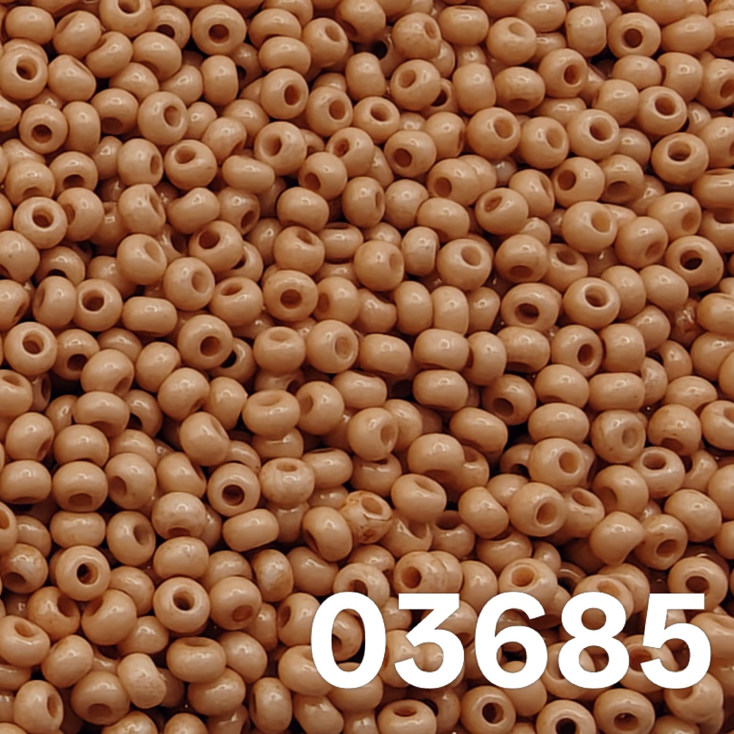 Preciosa 10/0 Czech seed beads — Solgel Chalk Orange (03685), muted caramel/terracotta pastel.