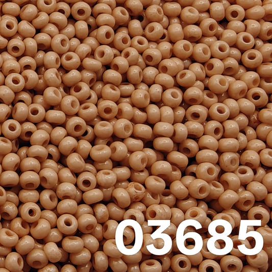 Preciosa 10/0 Czech seed beads — Solgel Chalk Orange (03685), muted caramel/terracotta pastel.
