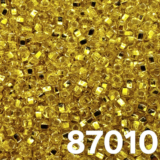 Preciosa 10/0 Silverlined Light Yellow seed beads, code 87010 — close-up of round silver-core beads