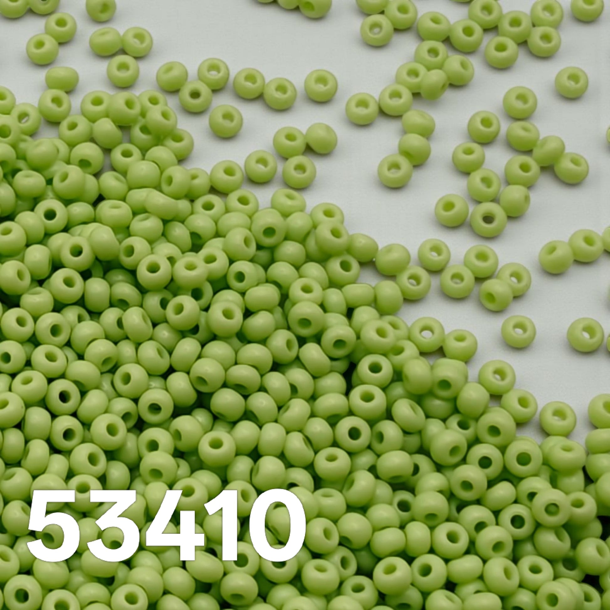 Preciosa 10/0 opaque pale green Czech seed beads 53410 close-up