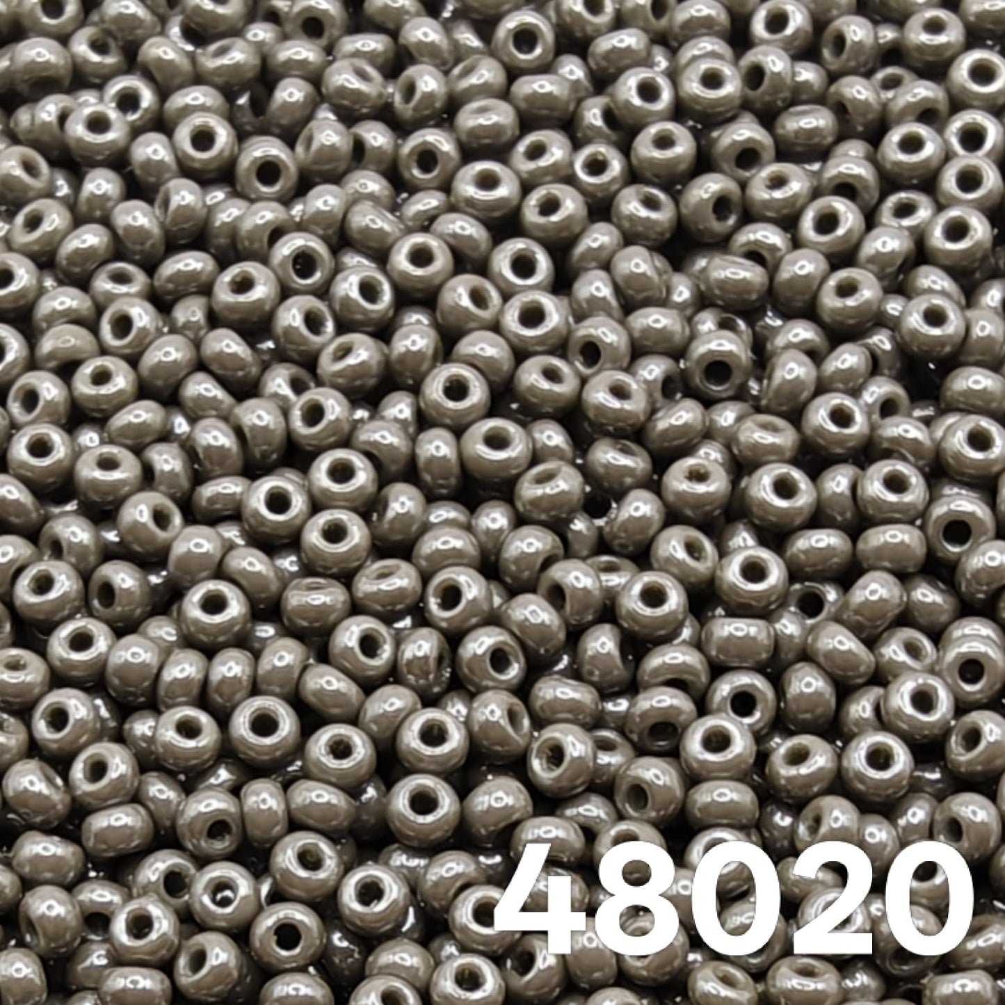 Preciosa Czech seed beads 10/0 Opaque Luster Grey 48020 — close-up of round glass beads for bead weaving and embroidery