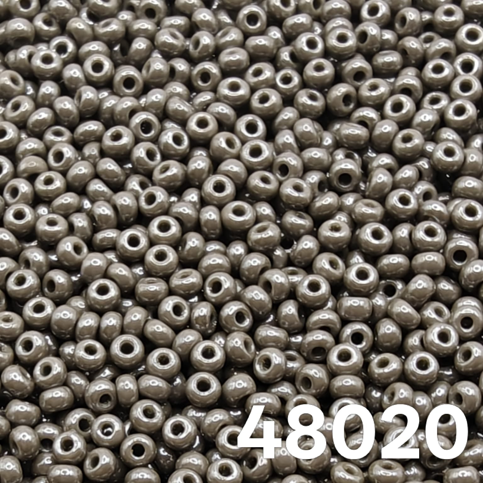 Preciosa Czech seed beads 10/0 Opaque Luster Grey 48020 — close-up of round glass beads for bead weaving and embroidery