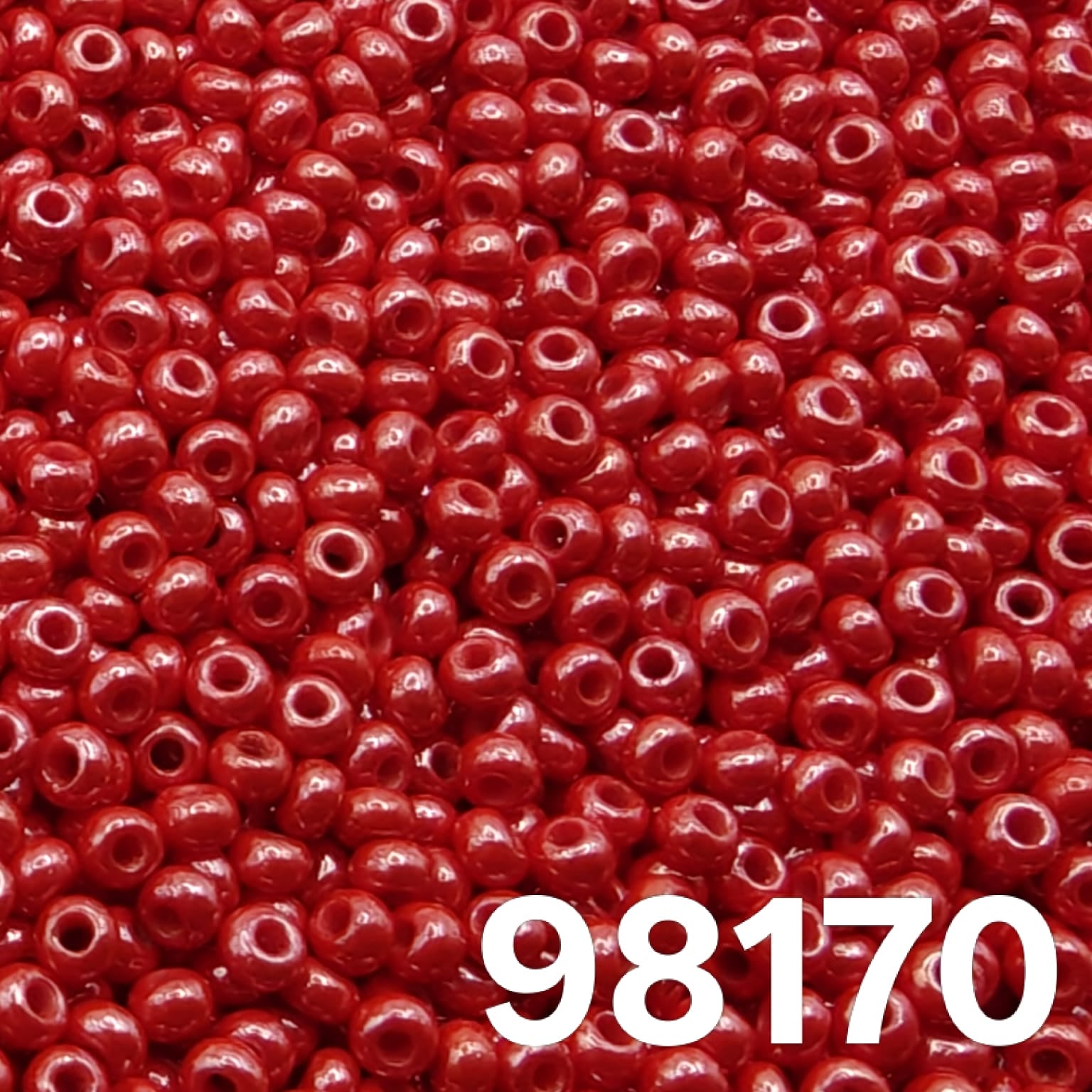 Preciosa Czech seed beads 10/0 Opaque Luster Light Red 98170 – close-up of round glass rocaille beads