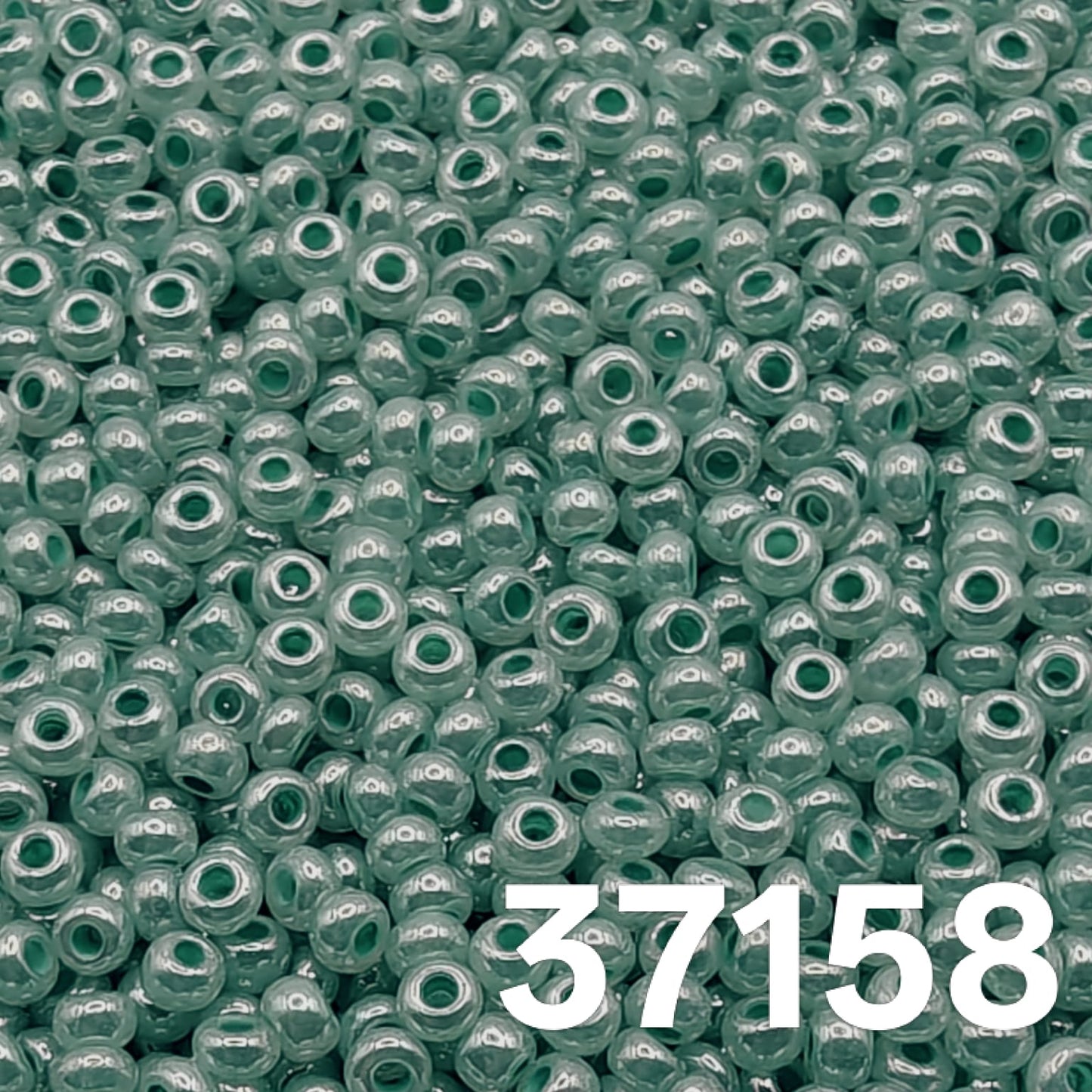Preciosa Czech seed beads 10/0, Pearlized Green Ceylon, col. 37158 – close-up of uniform round glass beads