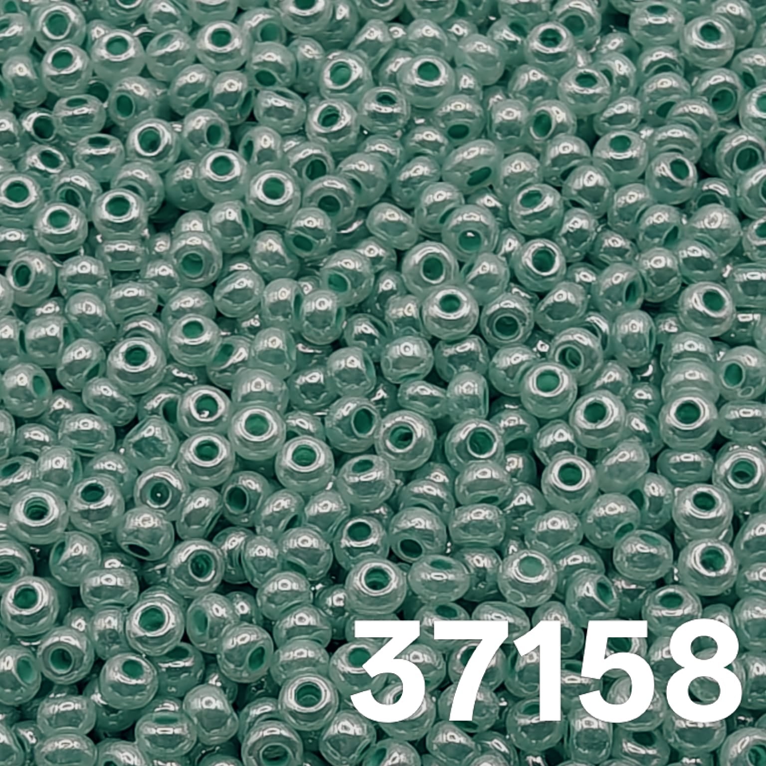 Preciosa Czech seed beads 10/0, Pearlized Green Ceylon, col. 37158 – close-up of uniform round glass beads