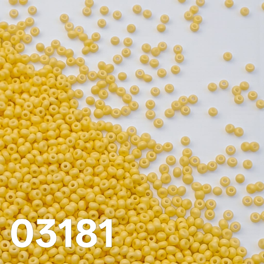 Preciosa Czech seed beads 10/0 Solgel Chalk Lemon Yellow colour 03181 scattered on white background