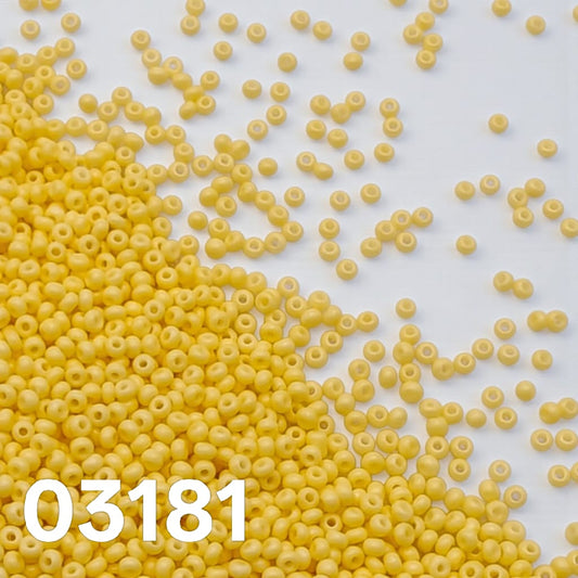 Preciosa Czech seed beads 10/0 Solgel Chalk Lemon Yellow colour 03181 scattered on white background