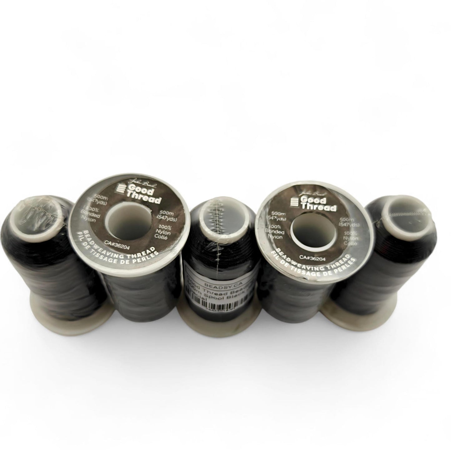 Row of Good Thread black bonded nylon beading thread spools, 500 m / 547 yds each for loom and off-loom beadwork