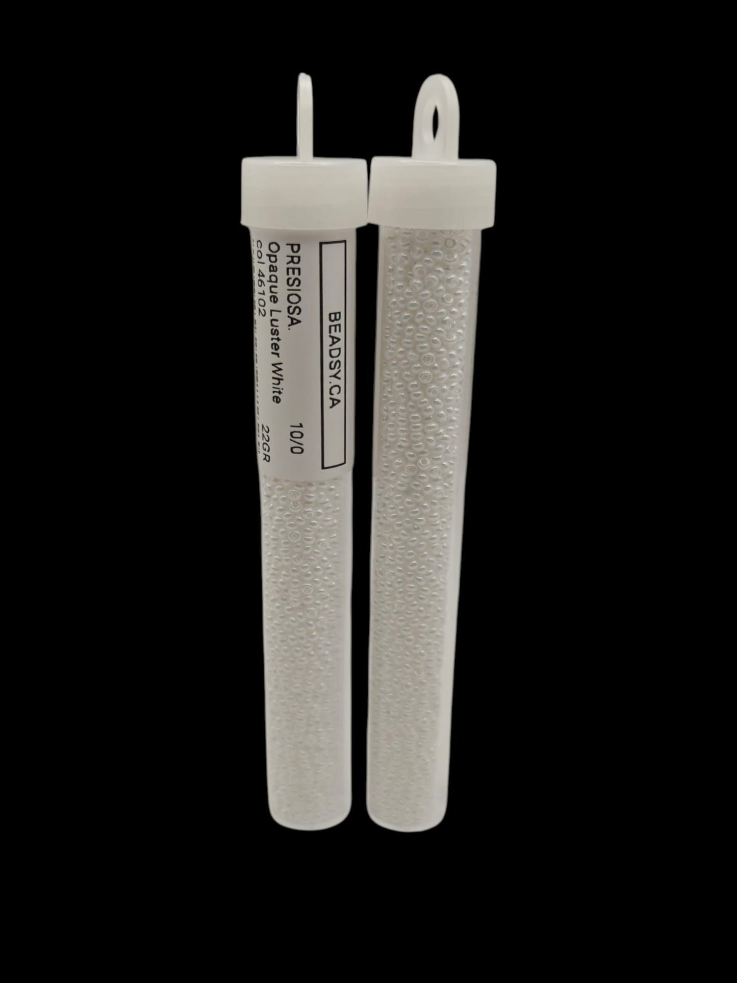 Two white cylindrical filters with labels on a black background