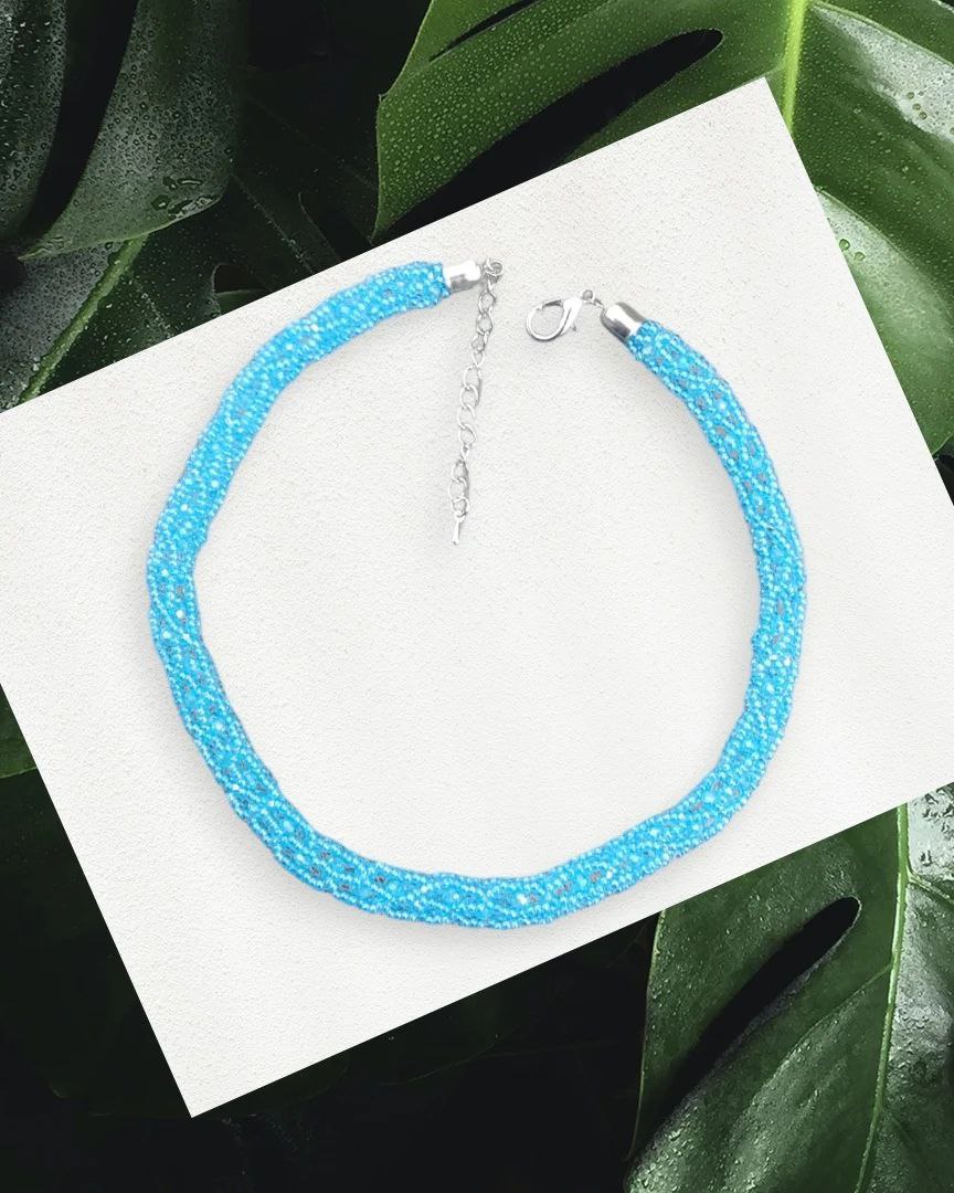 Turquoise bead-crochet choker close-up with silver-tone clasp