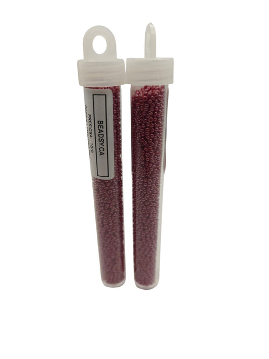 Two vials of Preciosa Czech seed beads 10/0 in color 98210 – opaque luster dark red