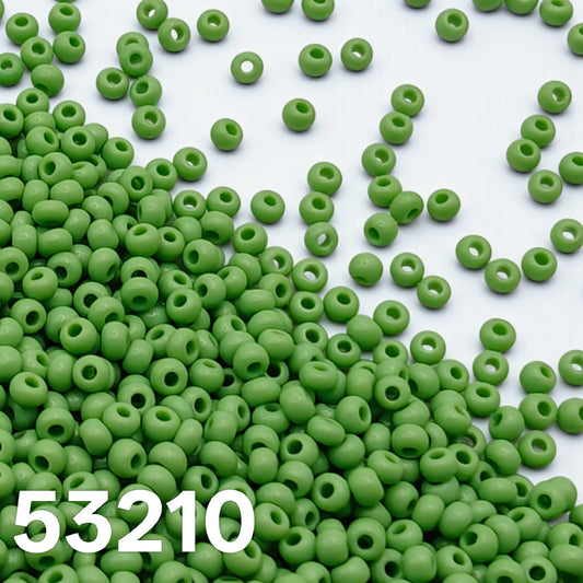 lime green czech seed beads size 10 scattered on white background
