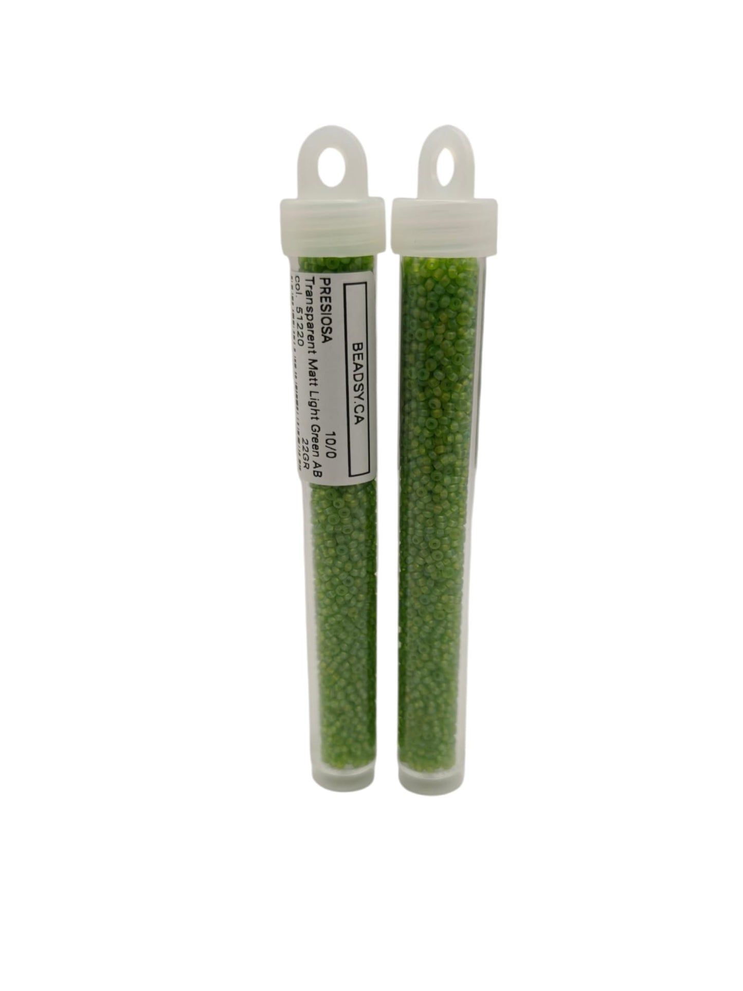 Transparent light green Czech seed beads in tube packaging